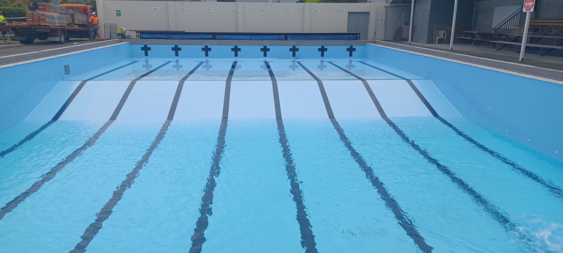 After: commercial swimming pool filled with blue water.